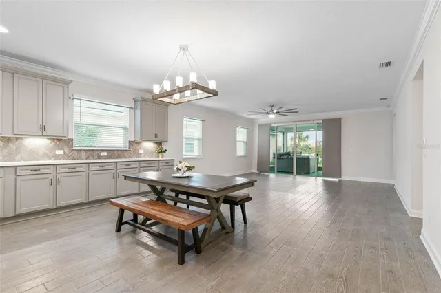 a kitchen with kitchen island granite countertop stainless steel appliances a sink and counter space
