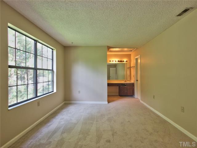 7618 Falcon Rest Circle, Unit 7618 Raleigh, NC 27615 - Photo 12 of 20 an empty room with windows