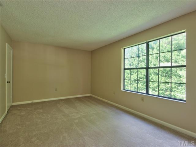 7618 Falcon Rest Circle, Unit 7618 Raleigh, NC 27615 - Photo 13 of 20 an empty room with a window