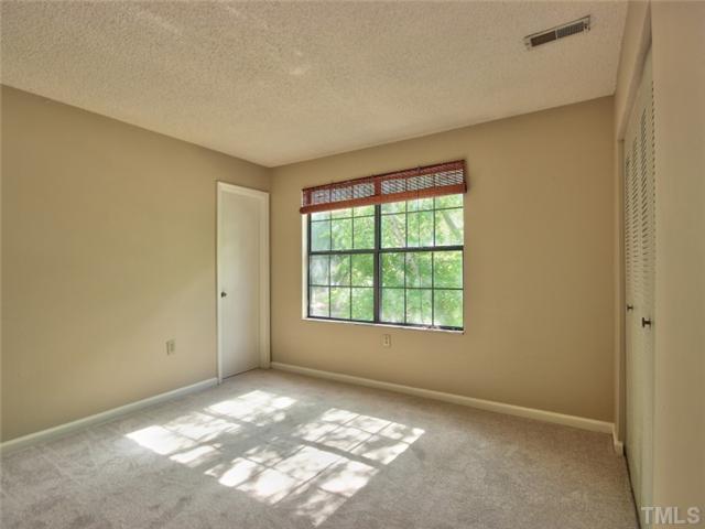 7618 Falcon Rest Circle, Unit 7618 Raleigh, NC 27615 - Photo 16 of 20 a view of an empty room with a window