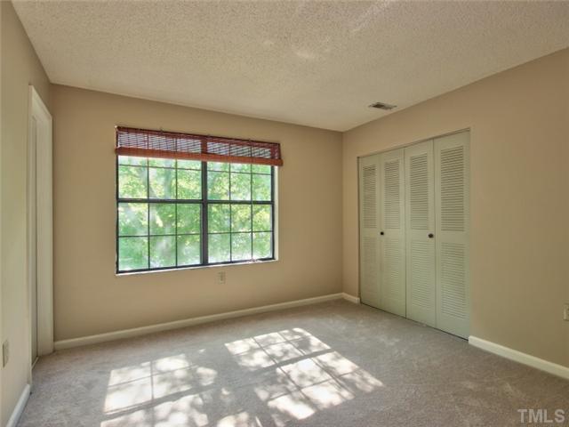 7618 Falcon Rest Circle, Unit 7618 Raleigh, NC 27615 - Photo 17 of 20 an empty room with windows