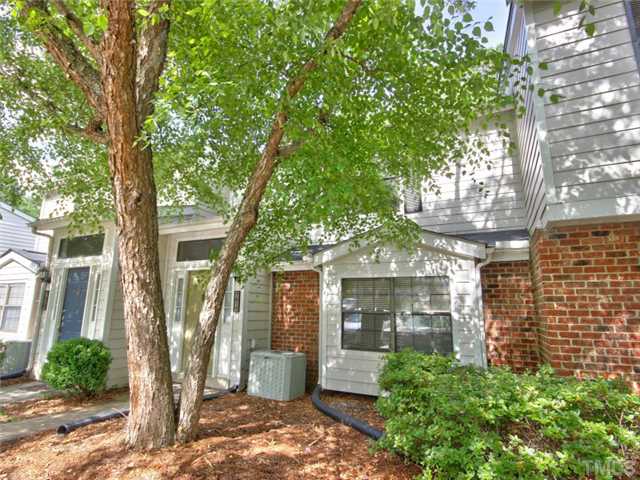 7618 Falcon Rest Circle, Unit 7618 Raleigh, NC 27615 - Photo 3 of 20 a front view of a house with a yard
