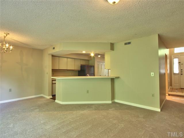 7618 Falcon Rest Circle, Unit 7618 Raleigh, NC 27615 - Photo 5 of 20 a view of a kitchen with a sink and a refrigerator