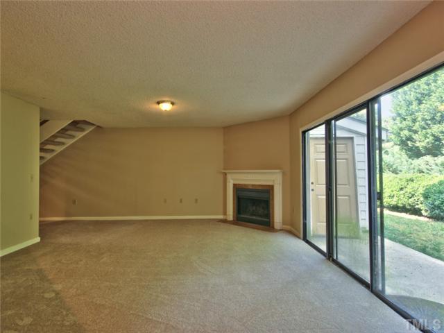 7618 Falcon Rest Circle, Unit 7618 Raleigh, NC 27615 - Photo 10 of 20 a view of empty room with fireplace