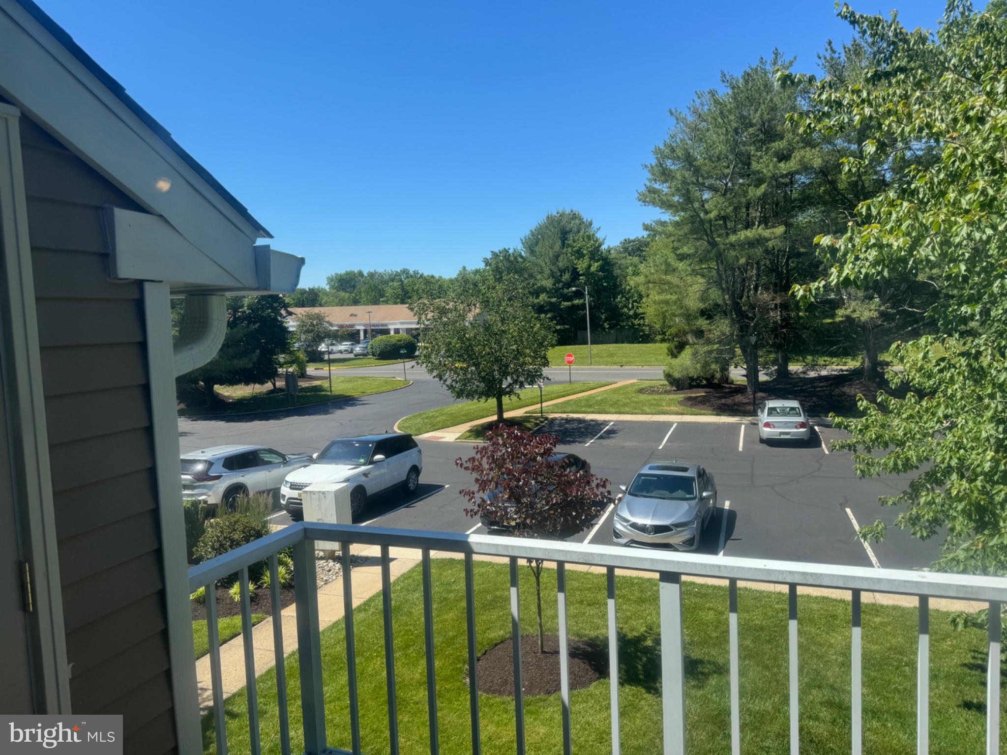 1908 B Ralston Drive Mount Laurel, NJ 08054 - Photo 24 of 24 Sunny balcony view with lush greenery.