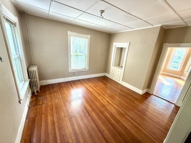 60 Massasoit Street Northampton, MA 01060 - Photo 6 of 19 a view of an empty room with wooden floor and a window