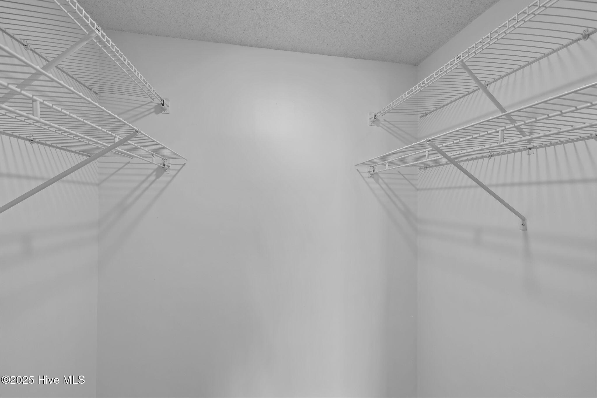 10300 Coast Guard Road, Unit D211 Emerald Isle, NC 28594 - Photo 29 of 54 Owners Suite Walk in Closet