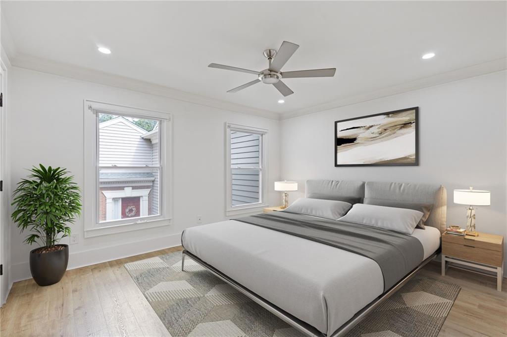 120 Mt Vernon Circle Atlanta, GA 30338 - Photo 18 of 44 a bedroom with a large bed and a potted plant