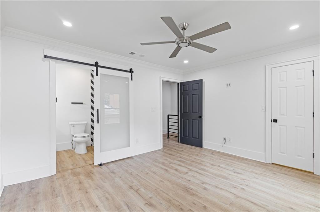 120 Mt Vernon Circle Atlanta, GA 30338 - Photo 19 of 44 a view of a livingroom with wooden floor and white walls