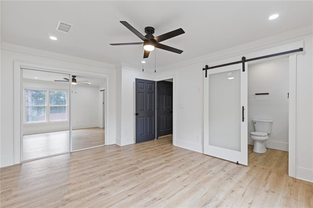 120 Mt Vernon Circle Atlanta, GA 30338 - Photo 26 of 44 a view of empty room with wooden floor and a ceiling fan