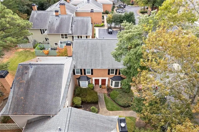 an aerial view of residential houses with outdoor space and street view
