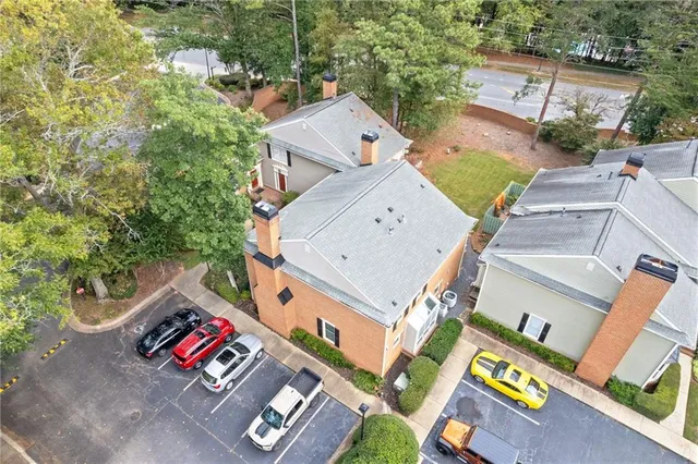 an aerial view of a house with swimming pool and outdoor space