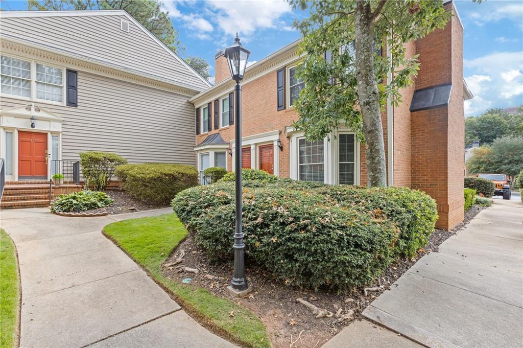 120 Mt Vernon Circle Atlanta, GA 30338 - Photo 4 of 44 a view of a house with a garden
