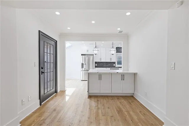 a view of kitchen with wooden floor