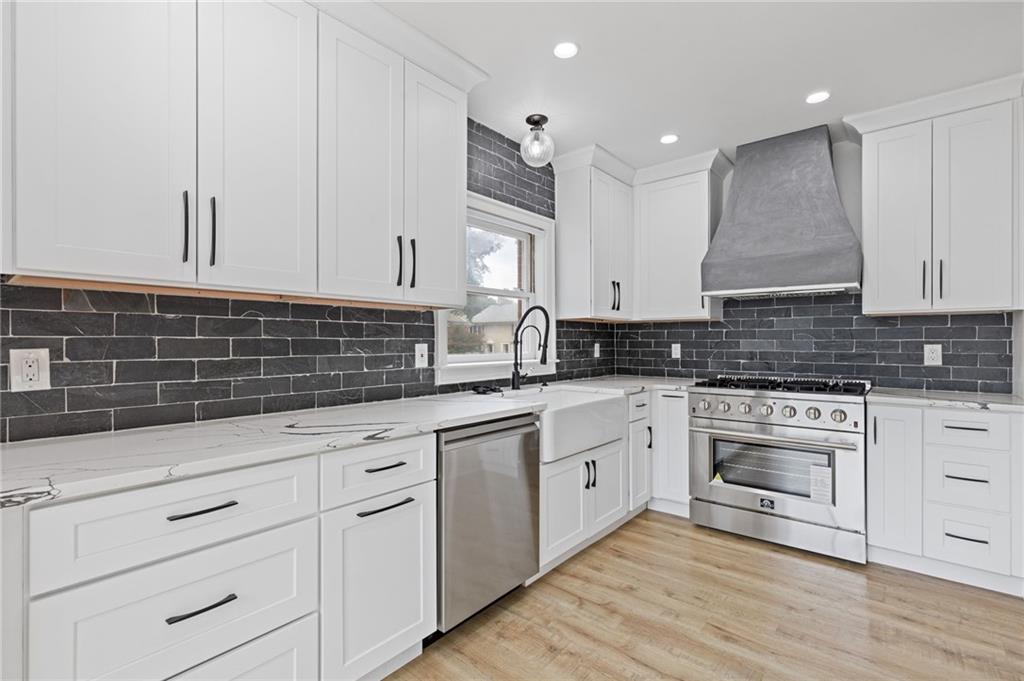 120 Mt Vernon Circle Atlanta, GA 30338 - Photo 10 of 44 a kitchen with white cabinets stainless steel appliances and sink