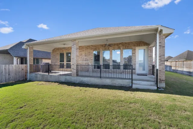 a view of a house with swimming pool and porch with furniture