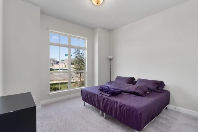 a living room with a couch and a window