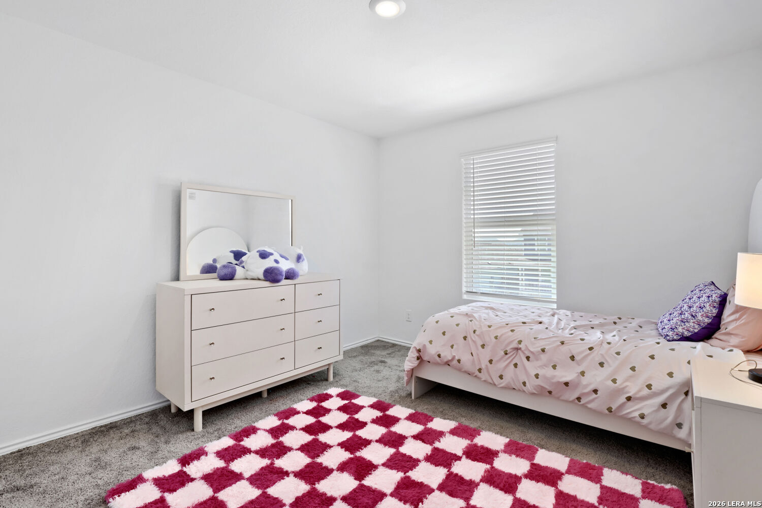 6017 Companion Loop Bulverde, TX 78163 - Photo 22 of 38 a bedroom with a bed and window
