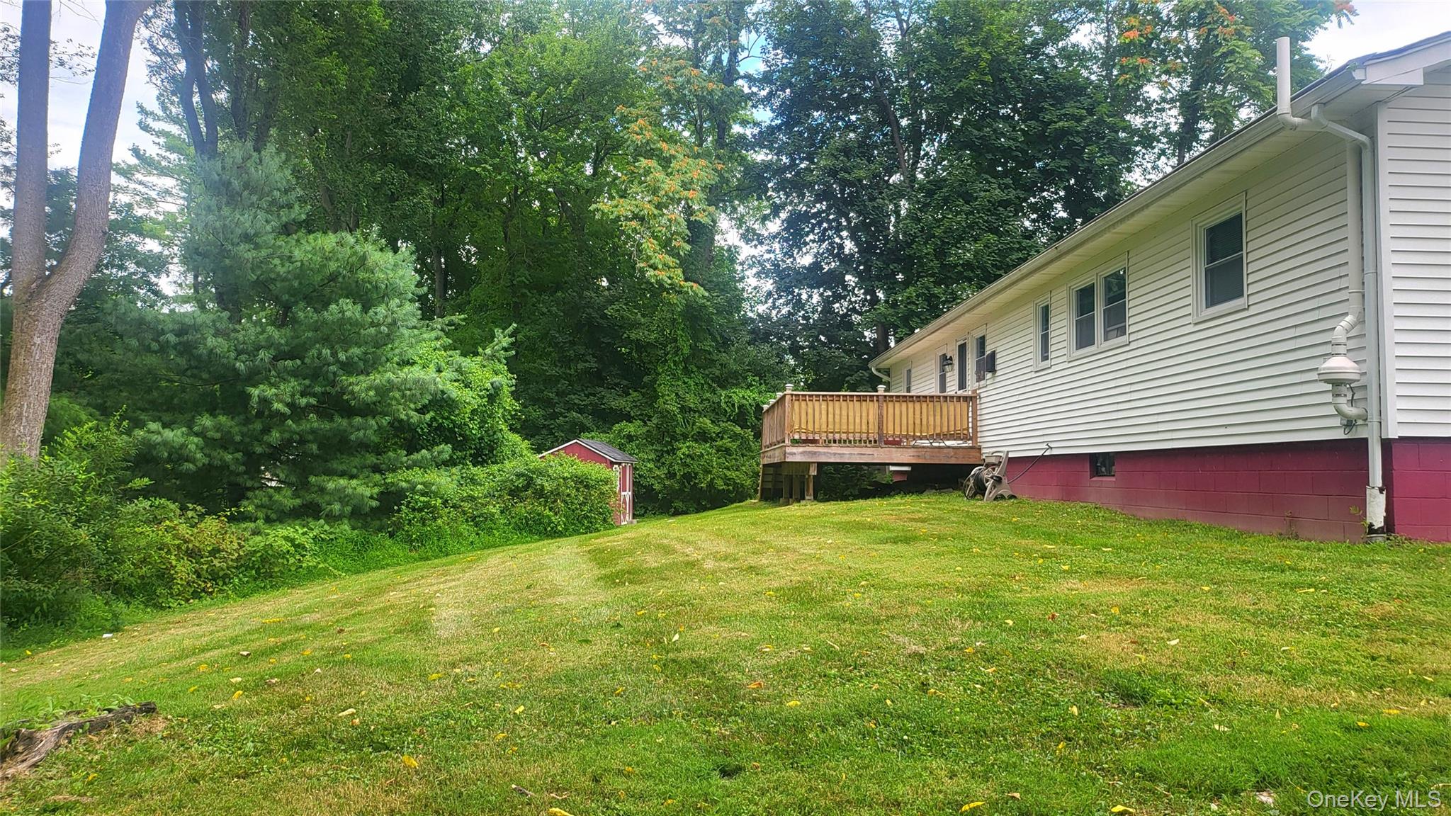 12 High Ridge Road Poughkeepsie, NY 12603 - Photo 30 of 34 Rear view with a deck and view of lawn