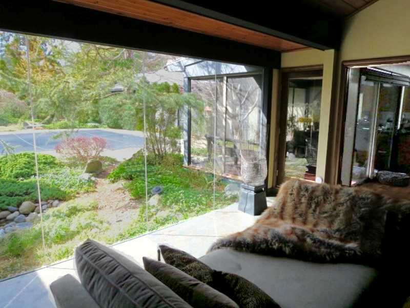 465 Potter Road North Kingstown, RI 02852 - Photo 4 of 25 Living Room. View from main house living room through architectural glass wall towards screened porch and pool