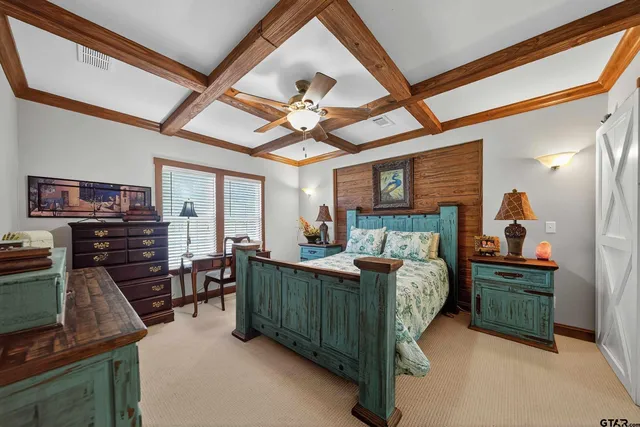 a bed room with furniture and a flat screen tv