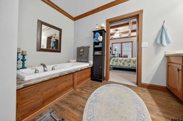 a en suite bathroom with a double vanity sink and a mirror