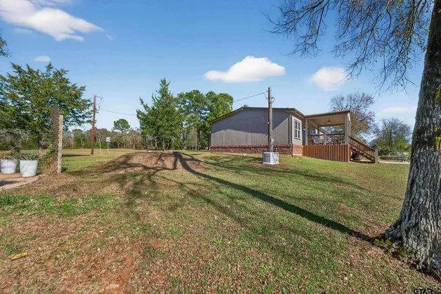 a view of a playground with a yard