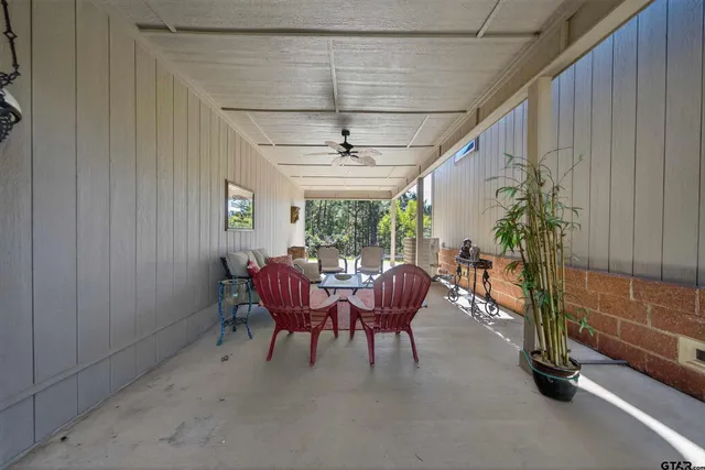 a view of a livingroom with furniture and a window