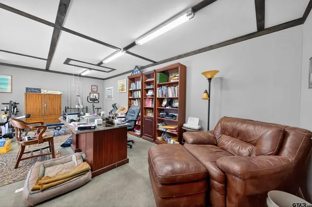 a living room with lots of furniture and air hockey table