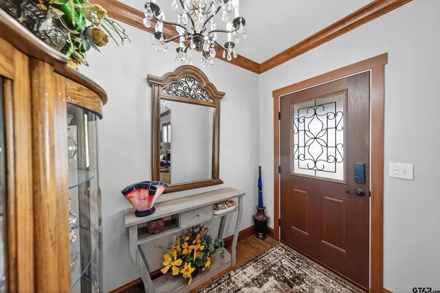 a view of an entryway with wooden floor