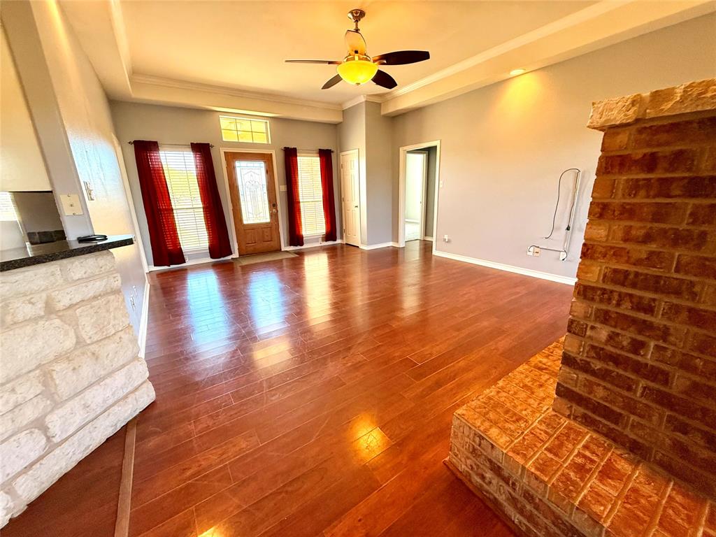 2429 Pecan Springs Road Cleburne, TX 76031 - Photo 15 of 21 a view of an empty room with window and wooden floor