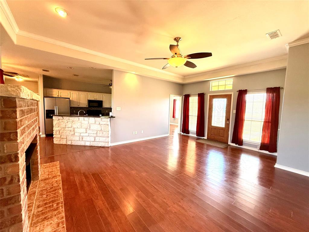 2429 Pecan Springs Road Cleburne, TX 76031 - Photo 17 of 21 a view of a livingroom with wooden floor