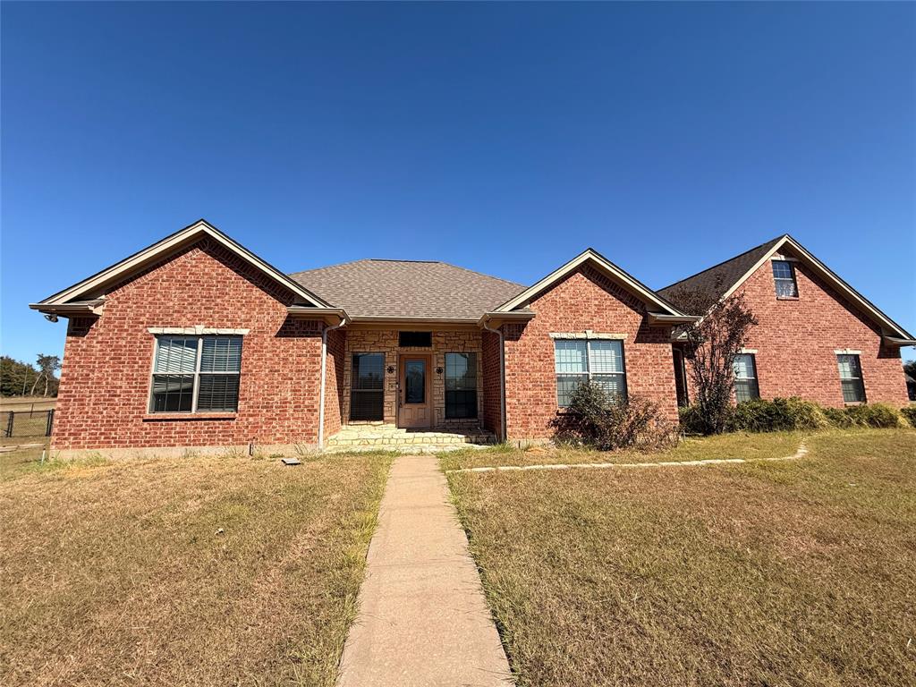 2429 Pecan Springs Road Cleburne, TX 76031 - Photo 5 of 21 a front view of a house with a yard