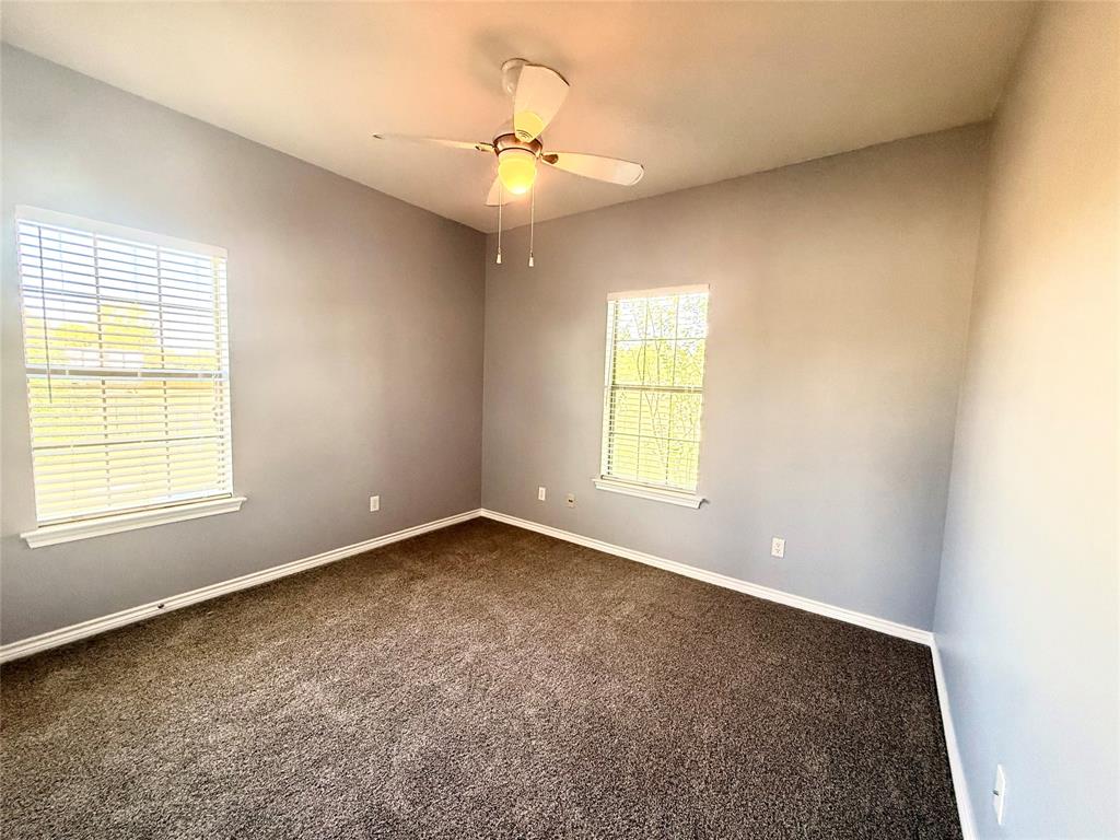 2429 Pecan Springs Road Cleburne, TX 76031 - Photo 9 of 21 an empty room with a window