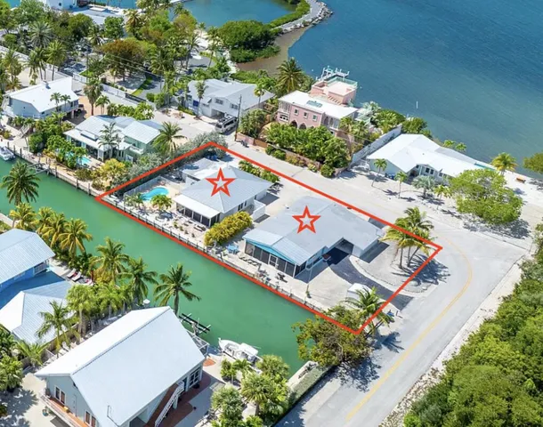 an aerial view of a residential houses with outdoor space