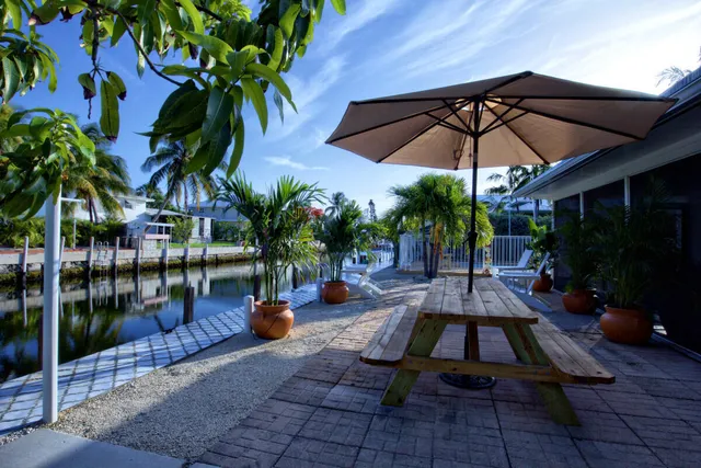 a view of a backyard with sitting area