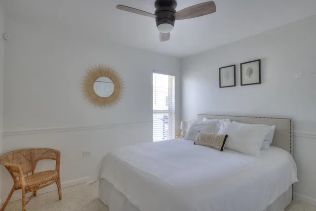 a bedroom with a bed and chair