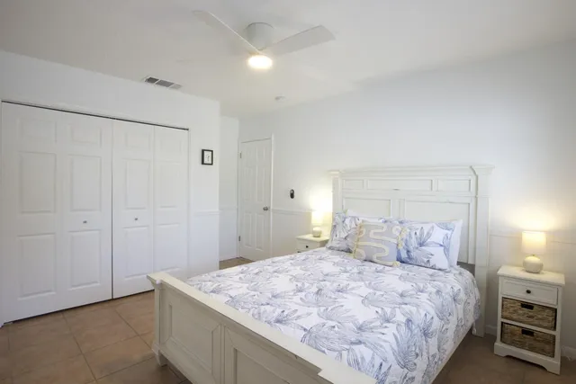 a bedroom with a bed and a cabinets