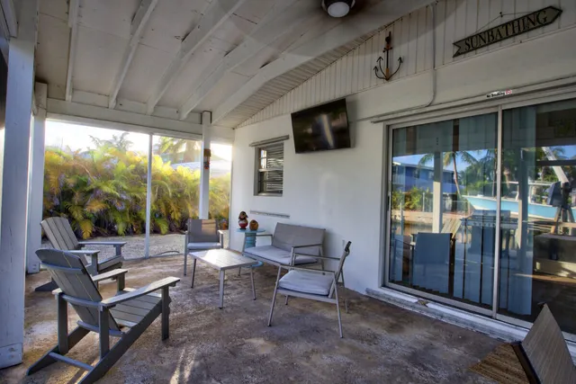 a building outdoor space with patio furniture and potted plants