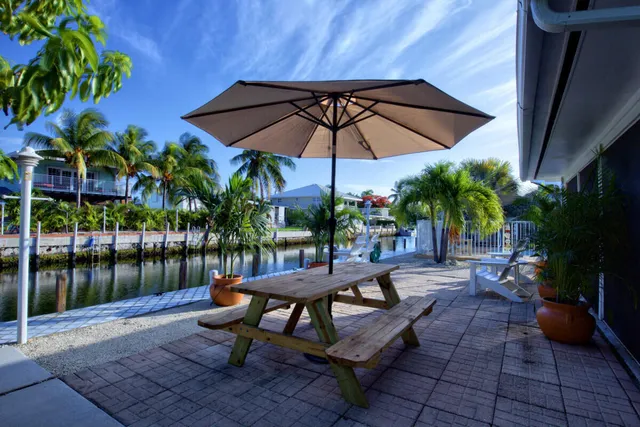 a view of a backyard with sitting area and furniture