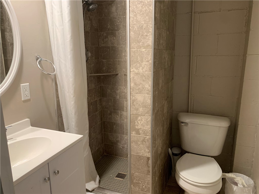 26 Sandcreek Drive Decatur, IL 62521 - Photo 23 of 29 a white toilet sitting next to a bathroom sink