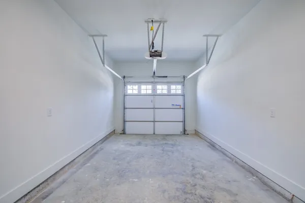 a view of an empty room with windows