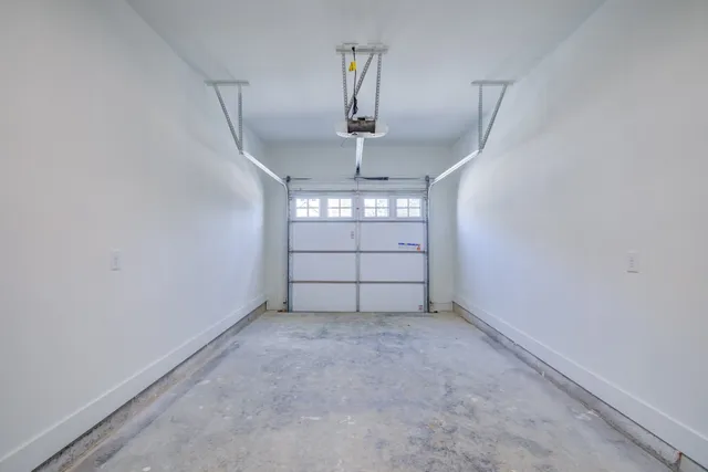 a view of an empty room with windows