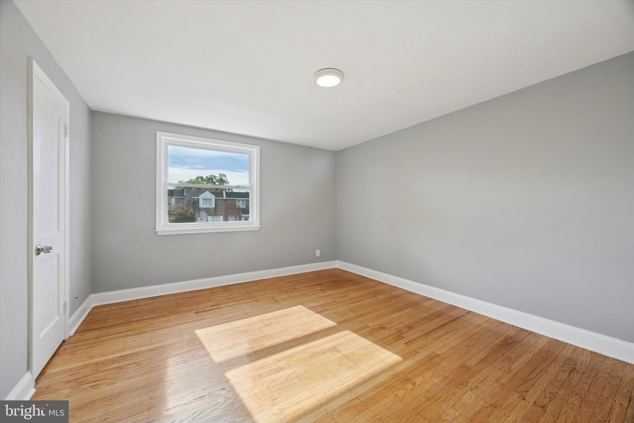 2006 Carter Road Folcroft, PA 19032 - Photo 11 of 25 a view of empty room with wooden floor and fan