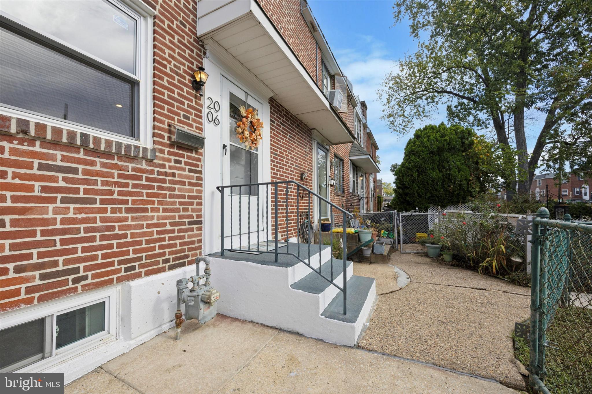 2006 Carter Road Folcroft, PA 19032 - Photo 22 of 25 a view of a patio with couches and table under an umbrella