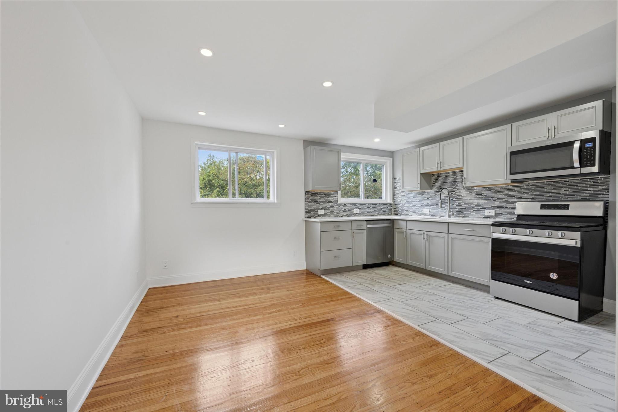 2006 Carter Road Folcroft, PA 19032 - Photo 3 of 25 a kitchen with a white cabinets and white appliances