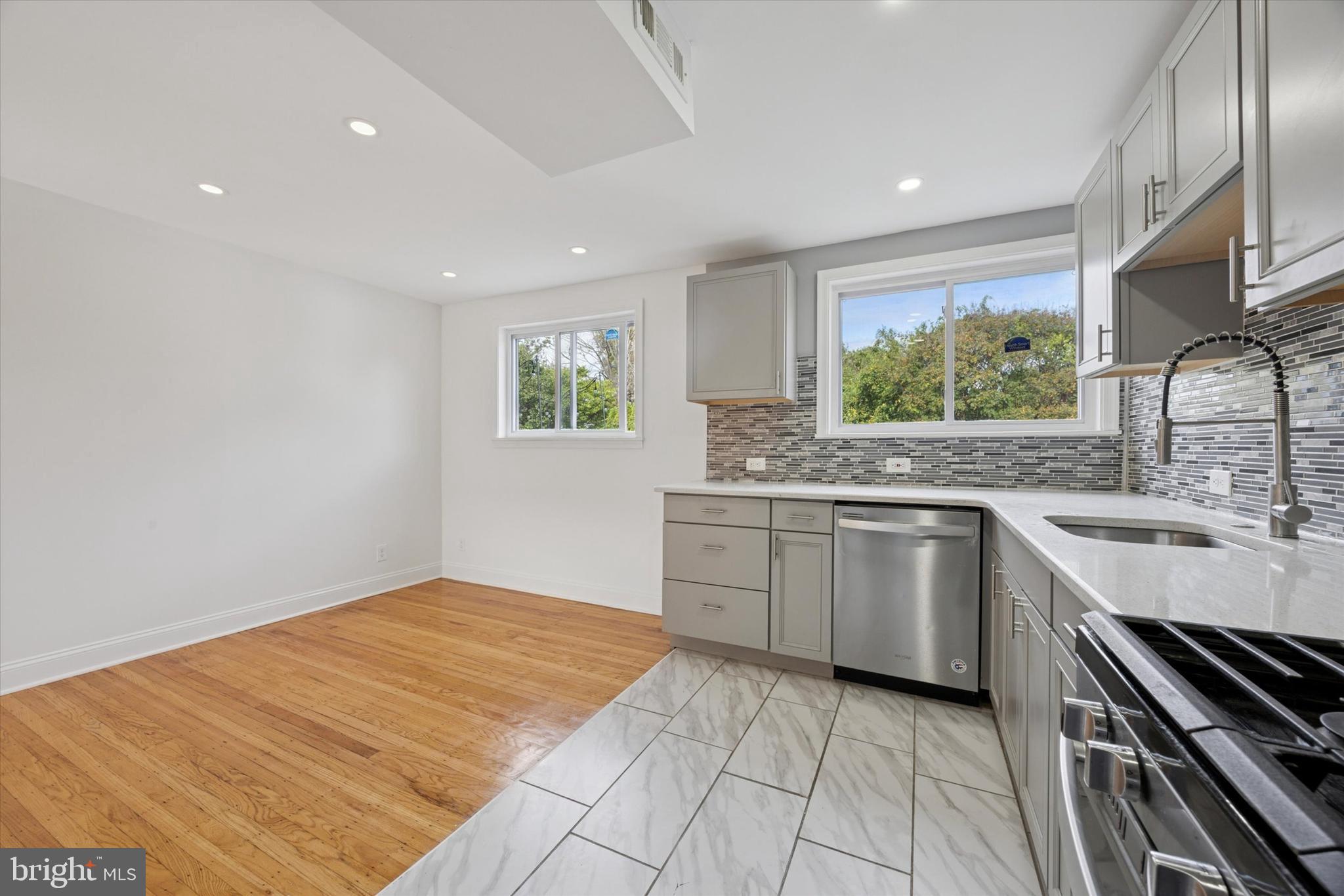 2006 Carter Road Folcroft, PA 19032 - Photo 5 of 25 a kitchen with a sink stove and cabinets