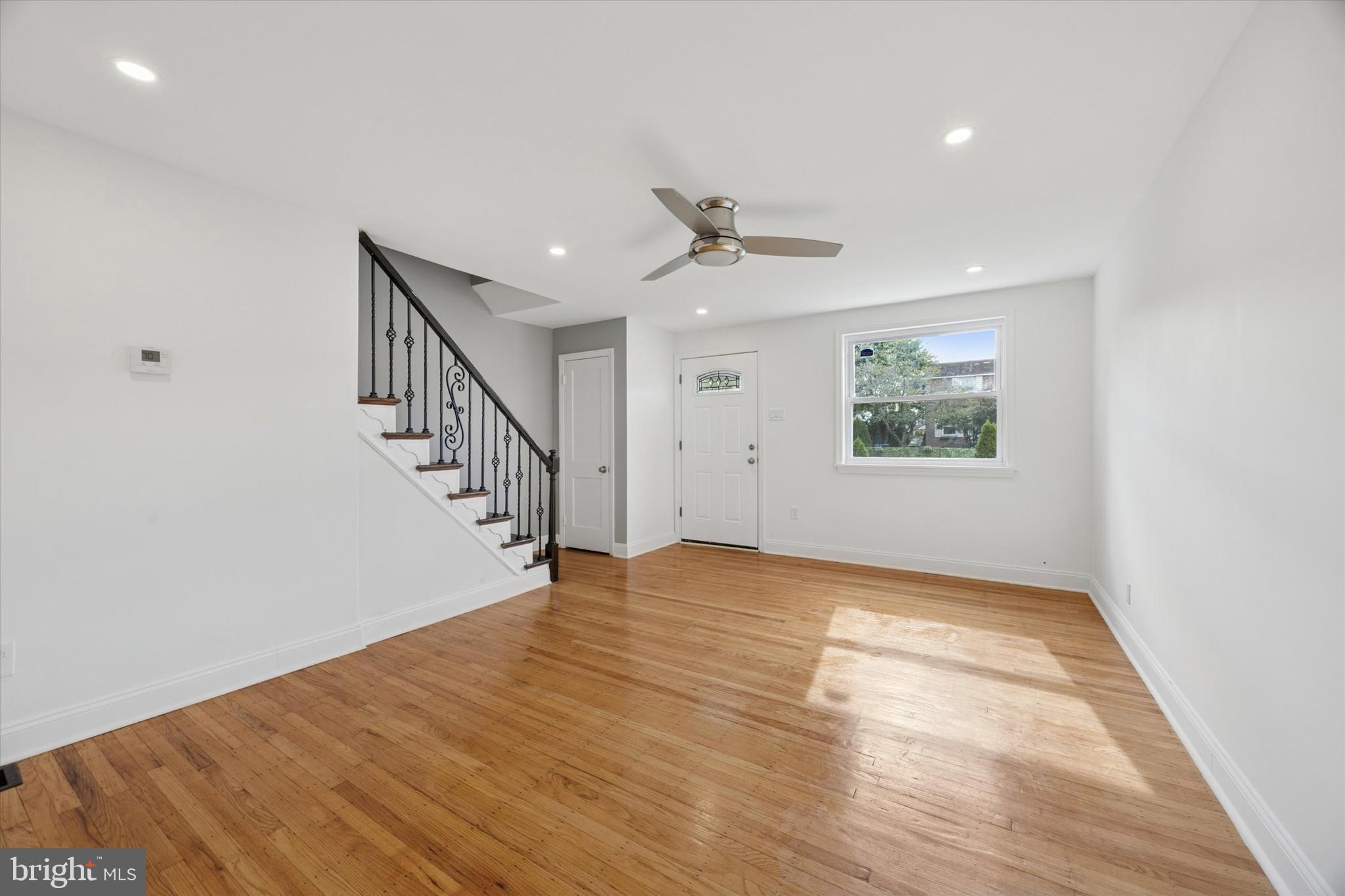 2006 Carter Road Folcroft, PA 19032 - Photo 8 of 25 a view of an empty room with wooden floor and a window