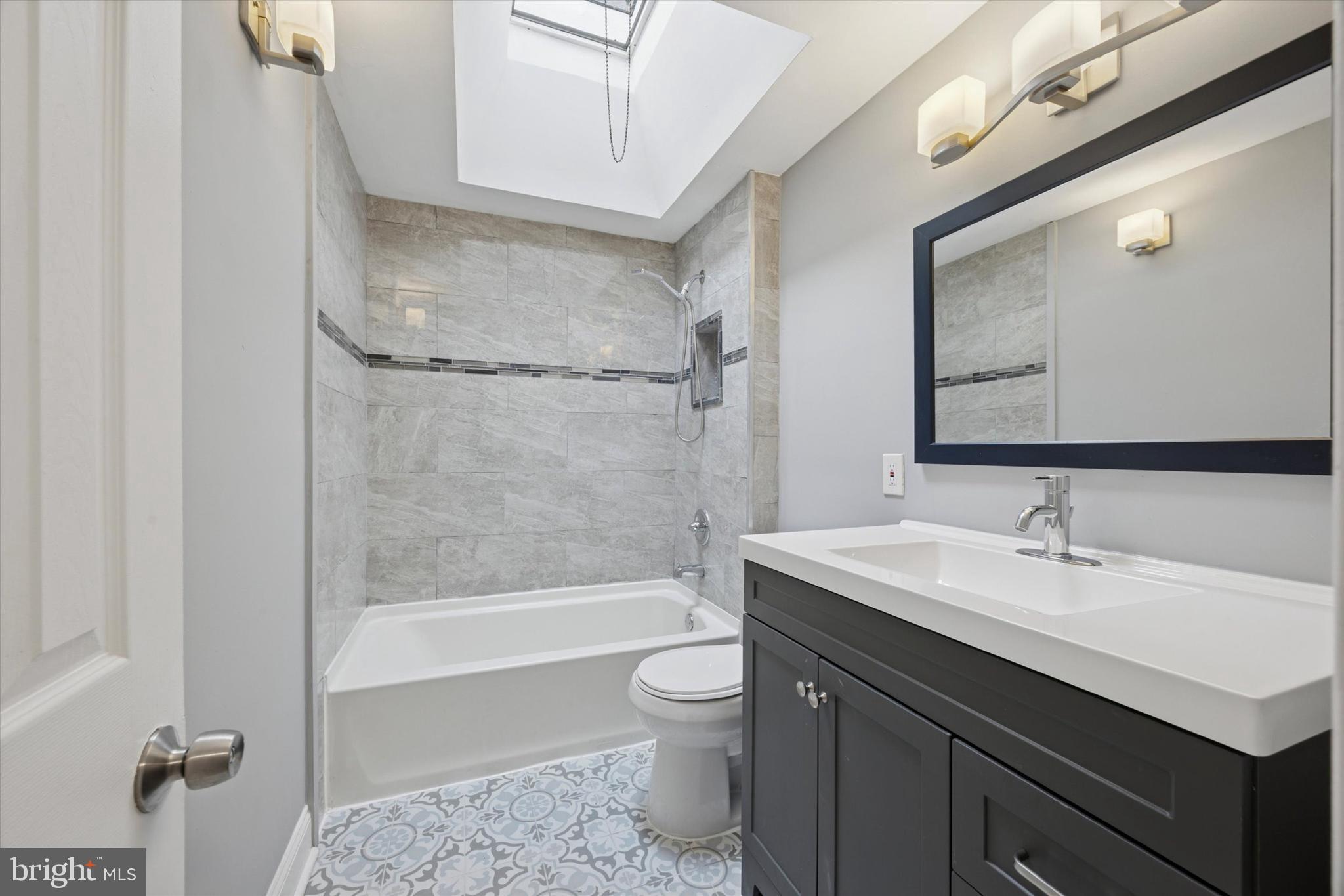 2006 Carter Road Folcroft, PA 19032 - Photo 9 of 25 a bathroom with a sink a toilet and shower