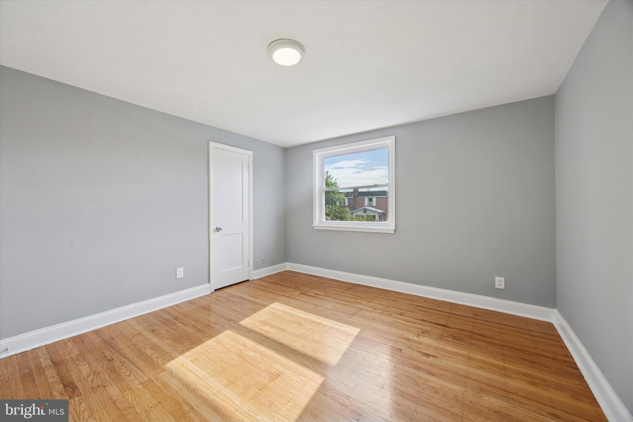 2006 Carter Road Folcroft, PA 19032 - Photo 10 of 25 a view of empty room with wooden floor and fan